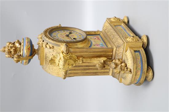 A 19th century French ormolu and porcelain clock garniture